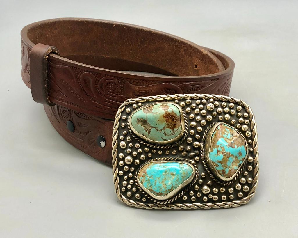 Hefty Three Stone Turquoise Buckle with Belt: For your review is a hefty three stone turquoise buckle with belt. This large belt buckle features three beautiful turquoise cabochons in various shades and shapes. They are accented with a cluster of