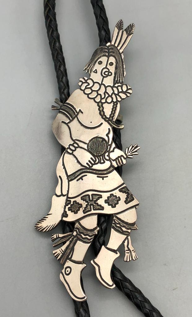 New-Old-Stock Mudhead Bolo Tie - Tommy Singer: Offered here for your consideration is a new-old-stock mudhead bolo tie by Navajo artist, Tommy Singer. This outstanding sterling silver mudhead slide features intricate designs accomplished through s