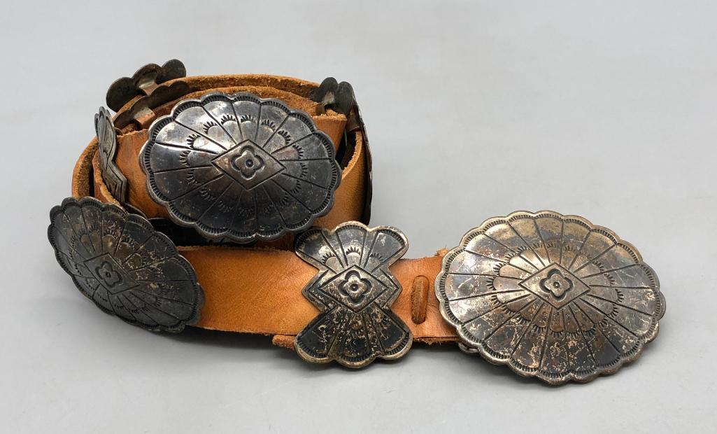 Vintage Smaller Size Sterling Silver Concho Belt: Available here for your consideration is a vintage smaller size sterling silver concho belt. This smaller belt features four oval and five butterfly conchos with intricate and well-done hand stamped d