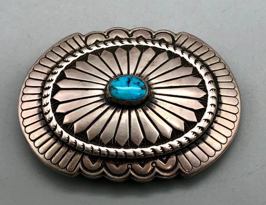 Turquoise & Sterling Silver Belt Buckle: Available here for your consideration is a turquoise and sterling silver belt buckle. This buckle features a beautiful turquoise cabochon and is accented with immaculate silverwork. The silverwork fea
