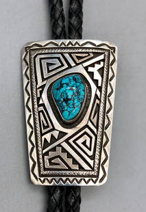 Webbed Turquoise & Sterling Silver Bolo Tie - Peter Nelson: Included in this lot is a gorgeous webbed turquoise and sterling silver bolo tie by Peter Nelson. This bolo features a webbed turquoise cabochon placed in a smooth bezel embraced by stunning geometric