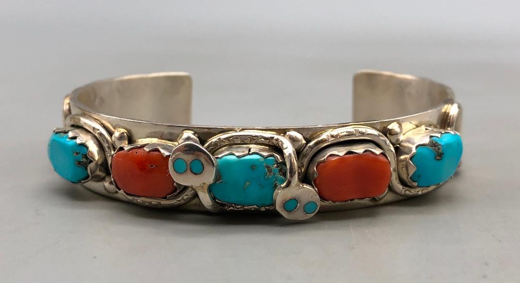 New Old Stock Effie C. Snake Bracelet: In this collection we have some new old stock, a Effie C. Snake bracelet. This gorgeous cuff bracelet holding three turquoise cabochons and two coral cabochons set in scalloped bezels while entangled 