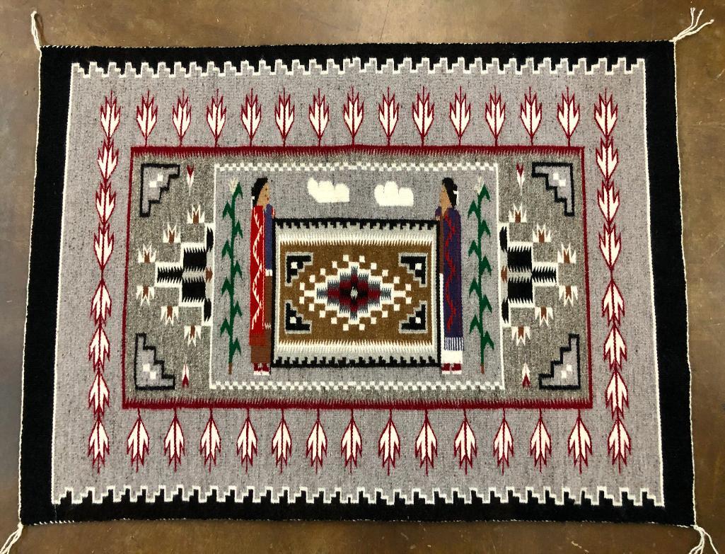 Pictorial Navajo Textile - Helen Begay: Available here for your consideration is a pictorial Navajo textile by Helen Begay. This rug features various pictorial designs includes two women holding up a perfect rug display, cornstalks, and oth