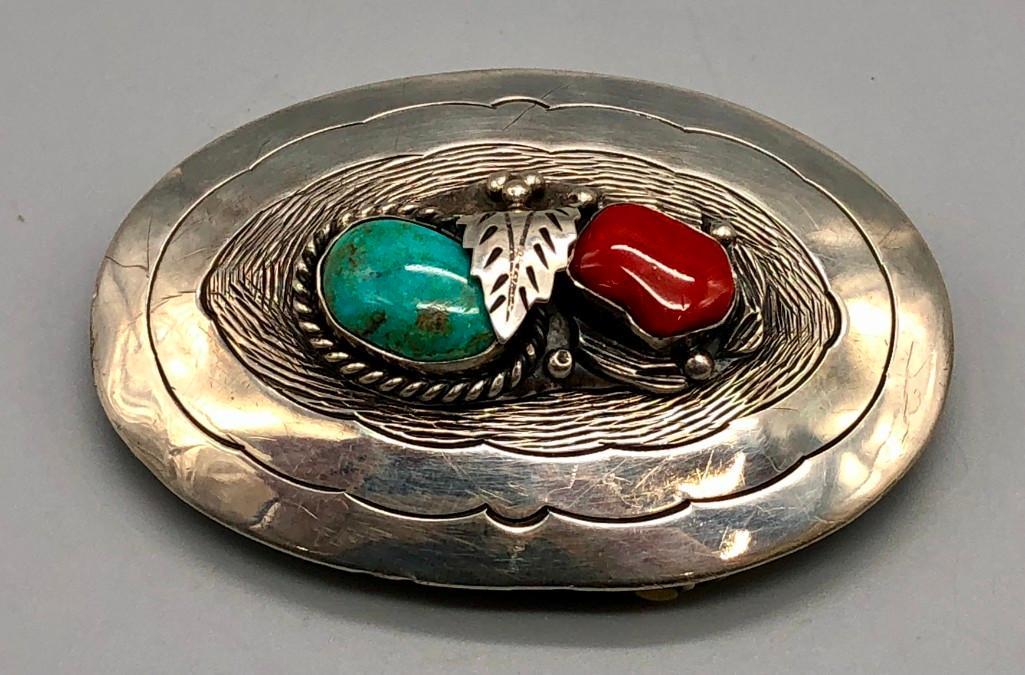 Great Turquoise and Coral Sterling Silver Belt Buckle: For your review is a great turquoise and coral sterling silver belt buckle. Highlighted with a turquoise and coral cabochon; one is accented with various silverwork and the other twisted wire, the set