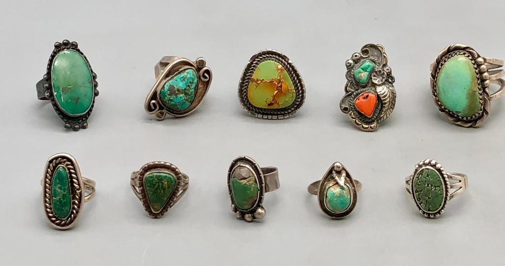 Group of Ten Green Turquoise and Sterling Silver Rings: For your bidding is a group of ten green turquoise and sterling silver rings. A great selection of varying green turquoise stones and intricate silverwork. A selection worth bidding on. MAKER: Unmarke