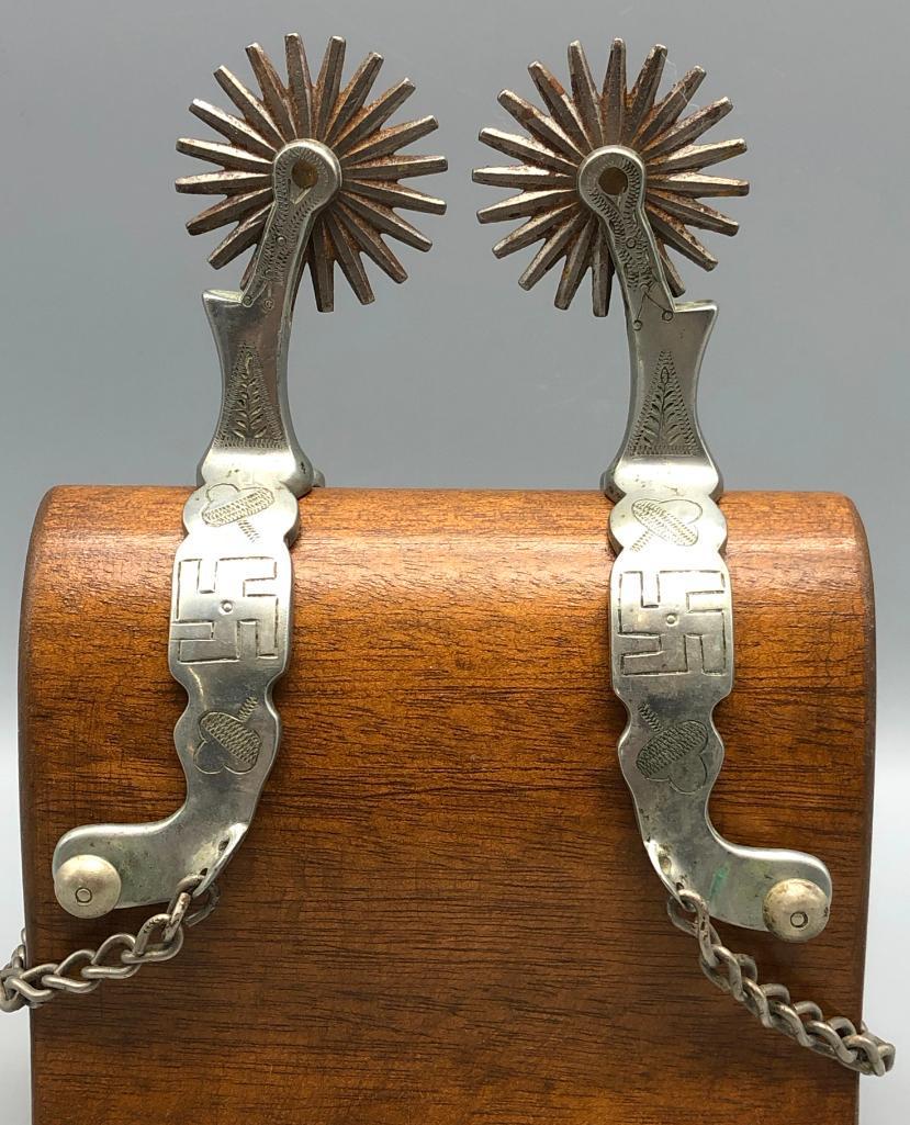 Buermann Whirling Log, Good Luck Spurs: Available here for your consideration is a rare pair of Buermann spurs with the Whirling log, or "good luck" pattern. Buermann Spurs are one of the most famous makers in Cowboy Spur history and they w