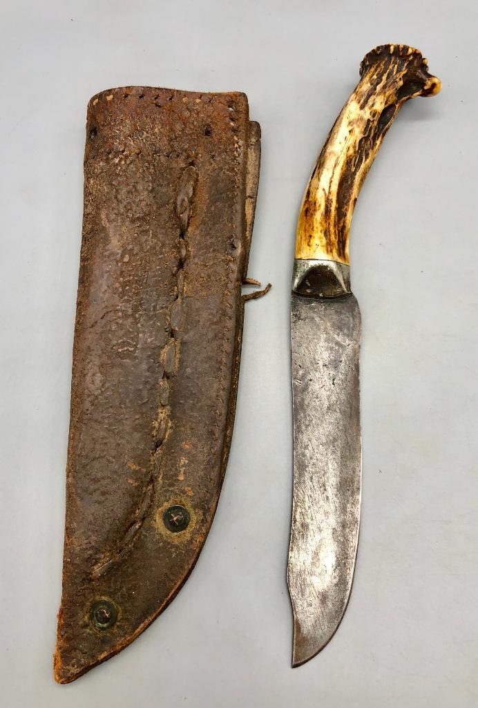 Old Antler Handle Handmade Knife with Sheath: Offered here for your consideration is an old antler handle, handmade (forged) knife with a sheath. It is perfect for knife collectors or people into Western style relics! Make it yours today! MAKER: 