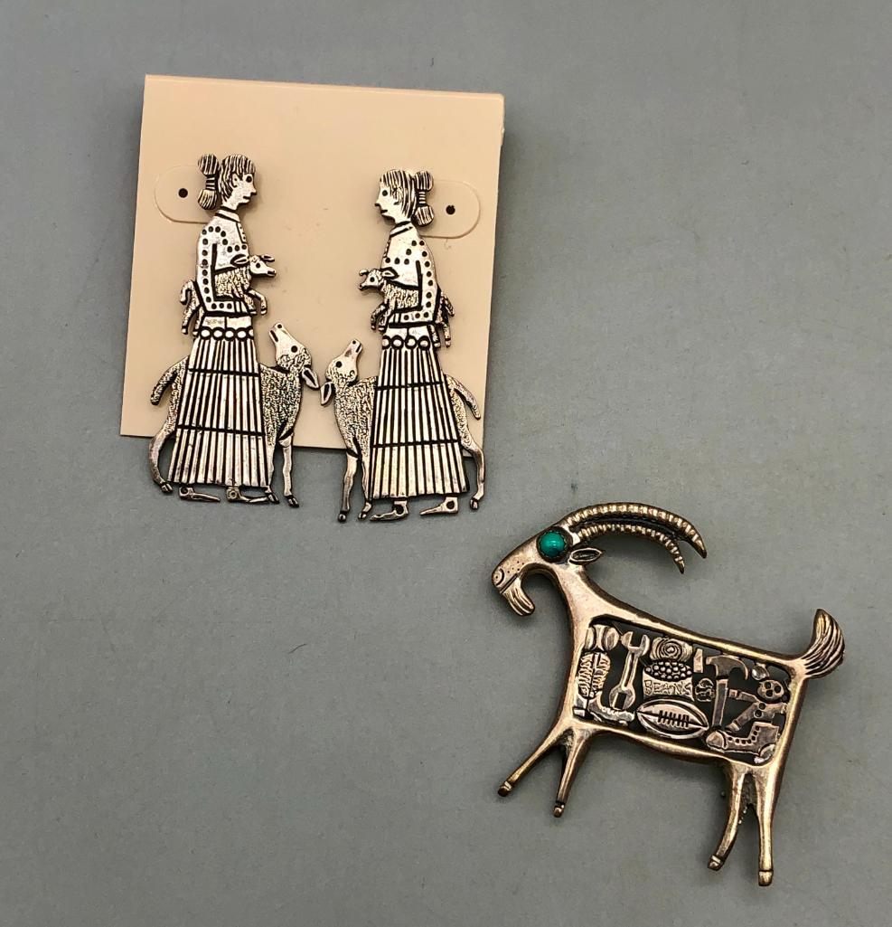 Clarence and Russell Lee Earrings and Pin: How precious are these...offered here for your consideration are Clarence and Russel Lee earrings and pin. The earrings are of a Navajo women tending sheep and the pin is a goat who seems to eat pecul