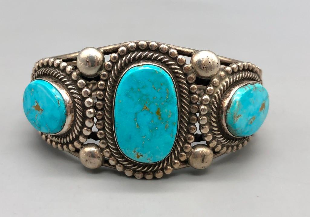 Hefty Three Stone Bracelet by Rick Martinez: For your review is a hefty three stone bracelet by Navajo artist, Rick Martinez. This retro style bracelet features three beautiful turquoise cabochons that are well accented with twisted wire and sil
