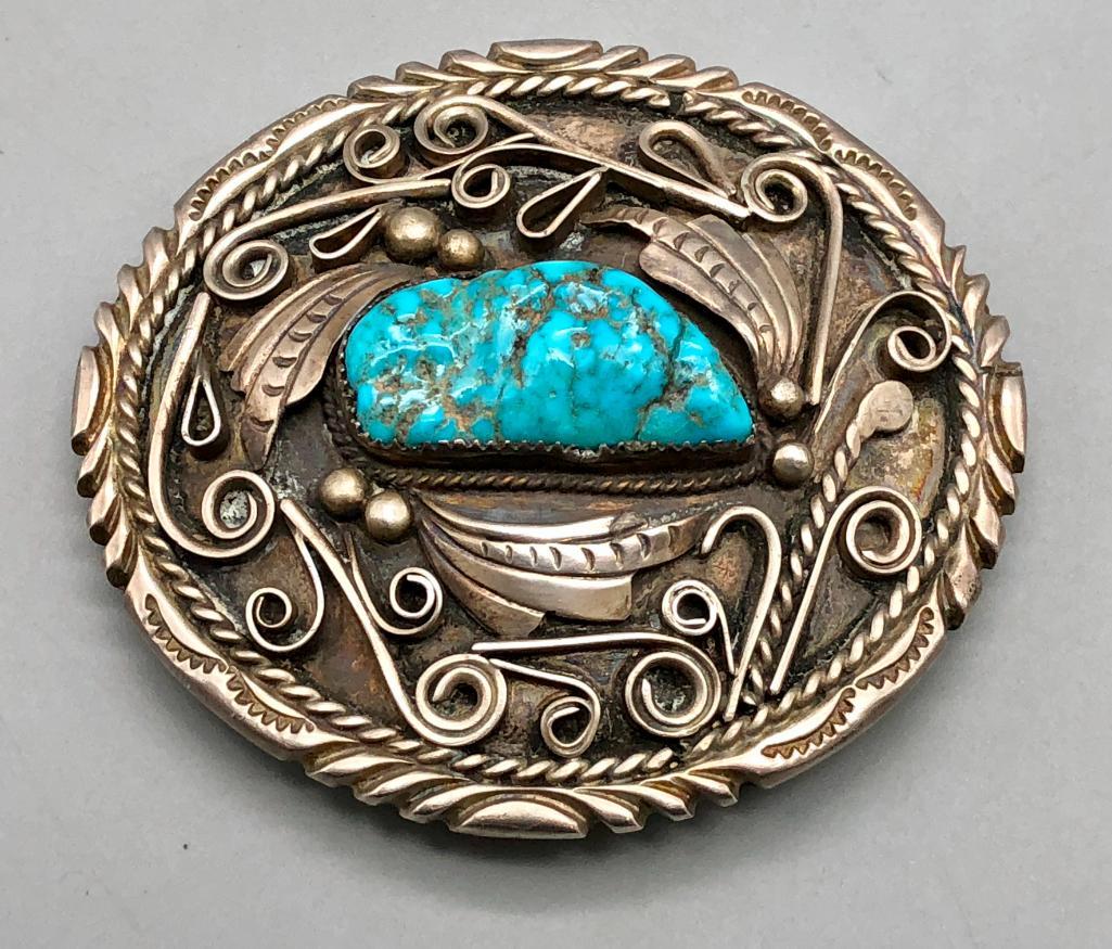 Vintage Turquoise Belt Buckle: Up for auction is a nice vintage belt buckle featuring a turquoise cabochon set in a handmade sawtooth bezel. The turquoise is elegantly framed by intricate silverwork that includes leaf and swirl app