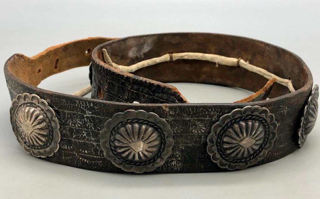 Vintage Small Size Concho Belt/Hat Band: Offered here for your consideration is a vintage small sized concho belt/hat band. The belt has eight stunning round conchos each with nice repousse work, twisted wire and hand stamping. The conchos a