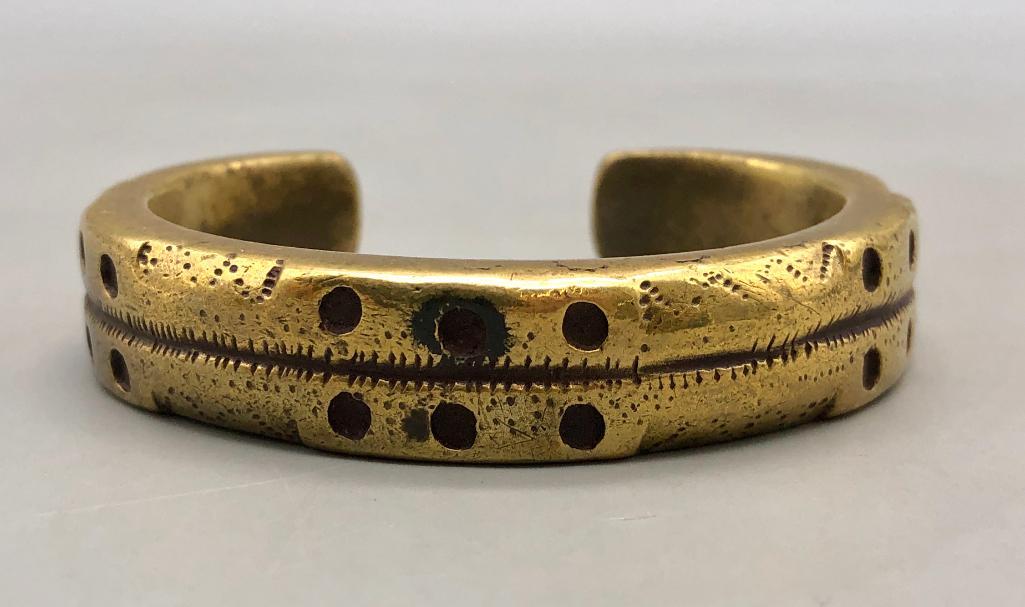 Old Ingot Brass Bracelet: For your bidding pleasure is an old ingot brass bracelet. This cool bracelet features a hefty feel, created out of brass, with drilled holes and hand stamped design accents. Add it to your collection!
