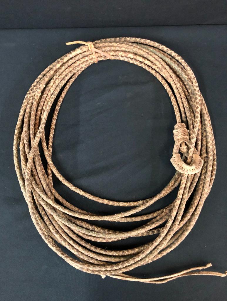 50 Foot Rawhide Reata: Offered here for your consideration is a hand braided 50 foot rawhide reata. MAKER: Unmarked. APPROX AGE: Vintage-(meaning somewhere between the 1930s-1970s). SIZE: This reata measures 50 foot from e