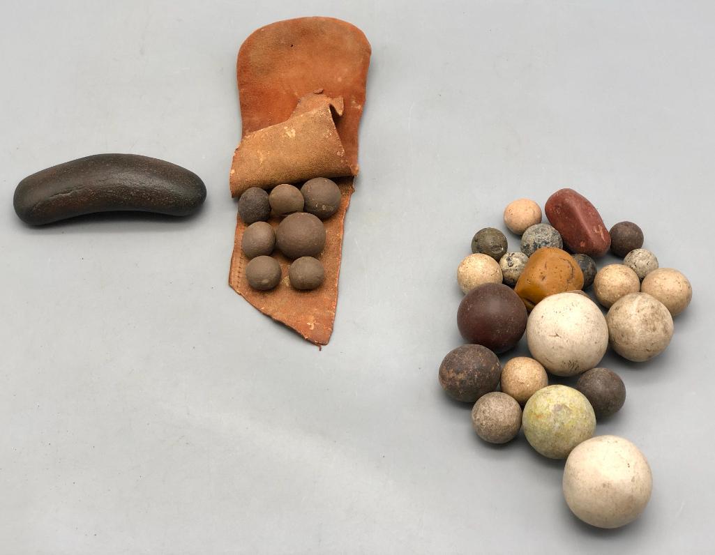 Group of Old Stone Gaming Pieces: Offered here for your consideration is a group of old stone gaming pieces. The small brown thin leather bag contains a group of small round stones, resembling modern day marbles. The other group of ro