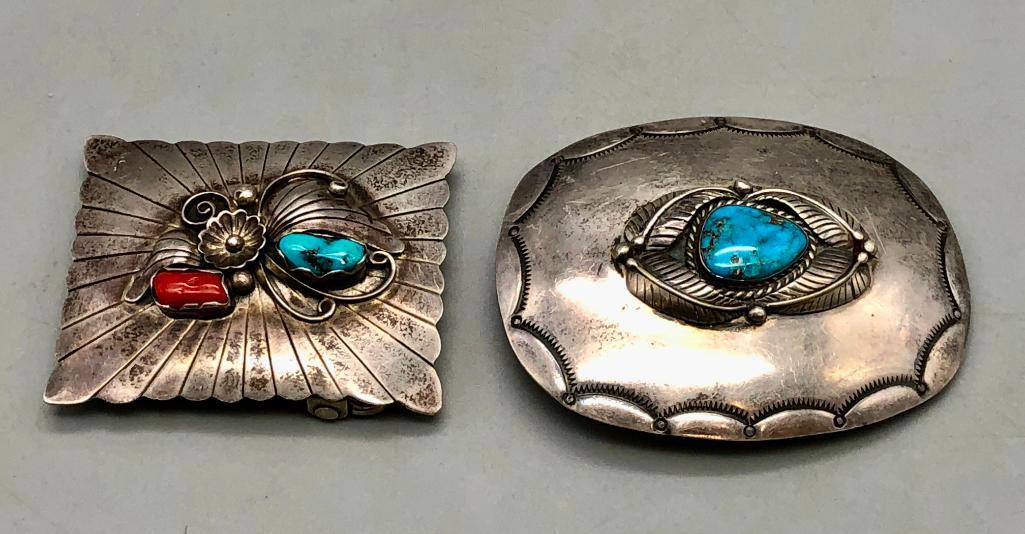 Two Vintage Turquoise Belt Buckles: Offered here for your consideration are two vintage turquoise belt buckles. These items feature a great variety of styles and design, showcasing turquoise and coral cabochons, with silverwork of silve