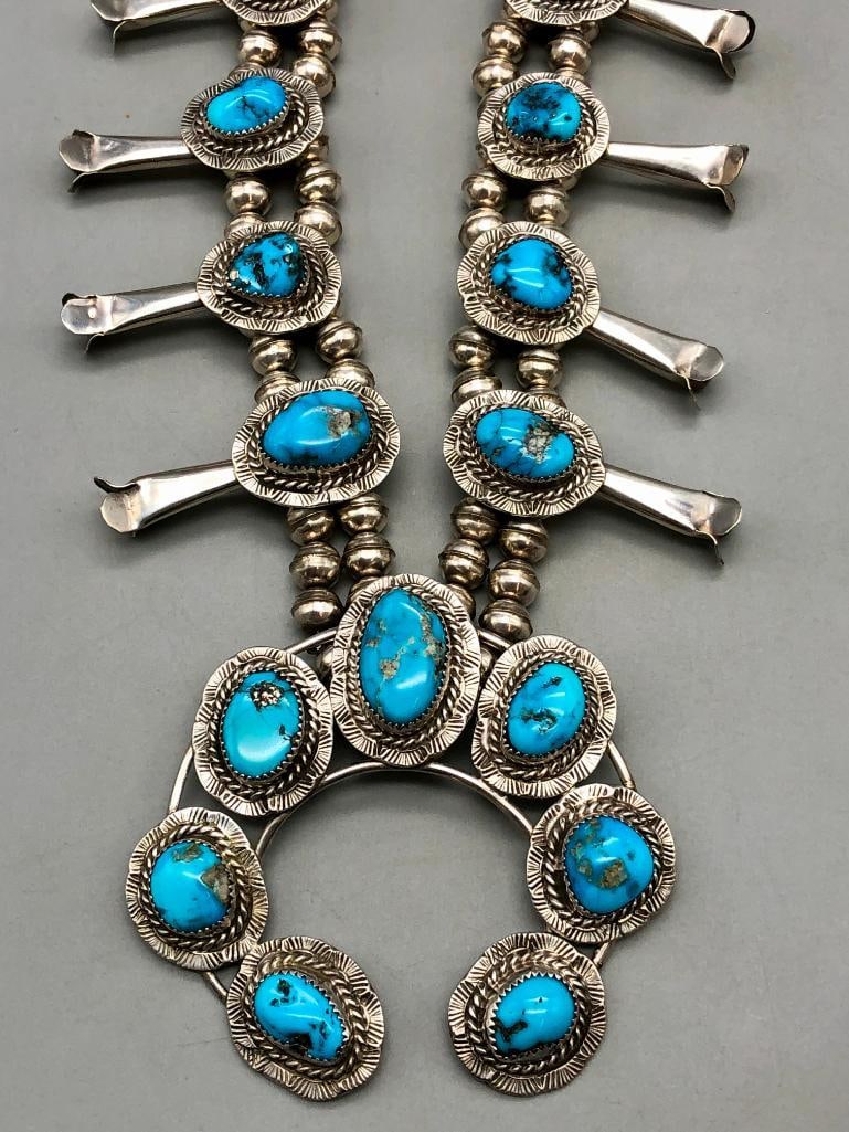 Turquoise And Sterling Silver Squash Blossom Necklace By Bobby Etsitty: Presented here for your bidding enjoyment is this turquoise and sterling silver squash blossom necklace by Bobby Etsitty. This incredible set features a beautiful naja showcasing seven turquoise 