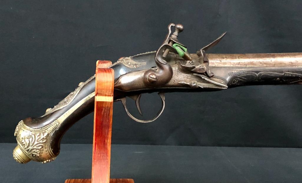 Ornate Early 1800s Flint Lock Pistol: Offered here for your consideration is a flintlock pistol which was likely made in the 1800s. It has a 13 1/4 inch barrel and is highly ornamented with jewel embellishments on the top strap. It is mis