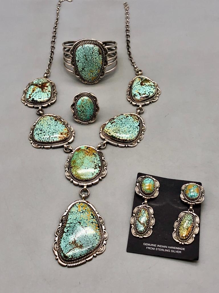 Exquisite Spiderweb Turquoise Necklace, Bracelet, Ring and Earring Set By Robert Kelly: Offered here is an exquisite spiderweb turquoise necklace, bracelet, ring, and earrings set. The set features wonderful spider web turquoise cabochons resting in handmade sawtooth bezels surrounded by