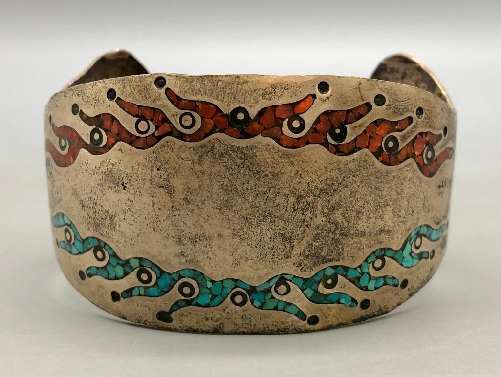 Vintage Coral And Turquoise Inlay Bracelet: Presented for your consideration is a vintage coral and turquoise inlay bracelet. This bracelet features a flush inlay design created with coral, onyx, and turquoise. The inlays are displayed on a uni