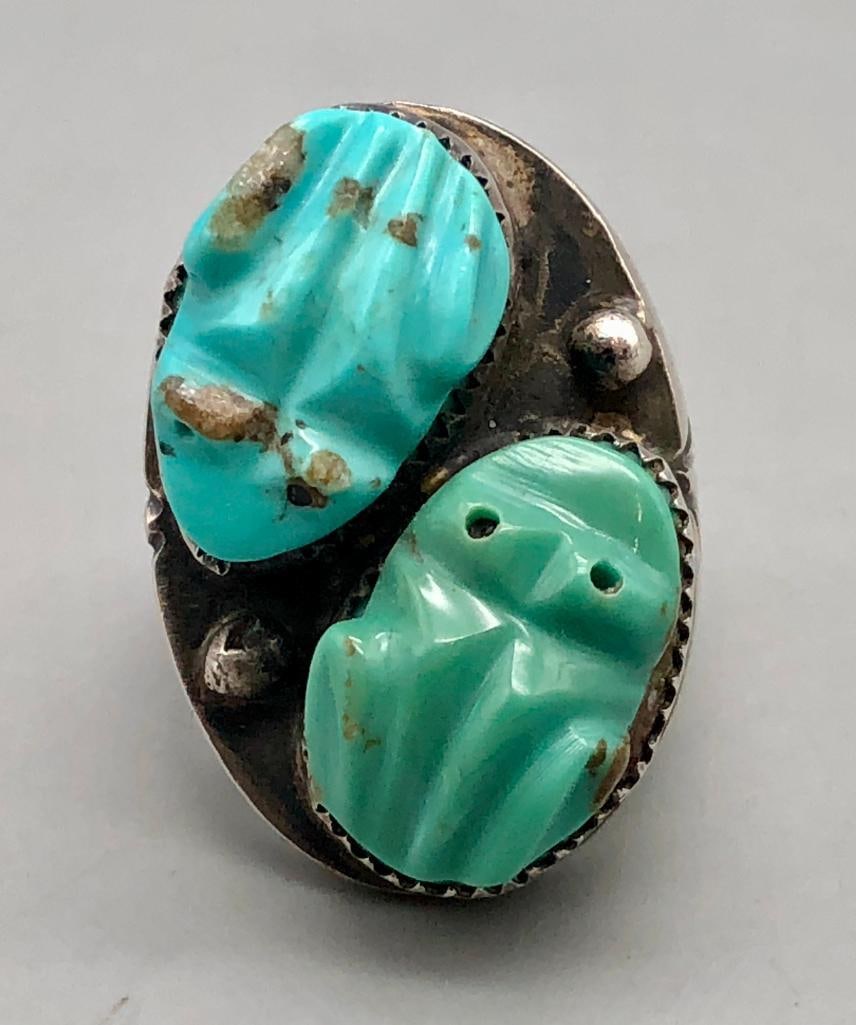 Massive Carved Turquoise Frog Ring: Offered here for your consideration is a massive carved turquoise frog ring. This unique ring features two carved turquoise frogs shaped cabochons resting in handmade sawtooth bezels and accented with