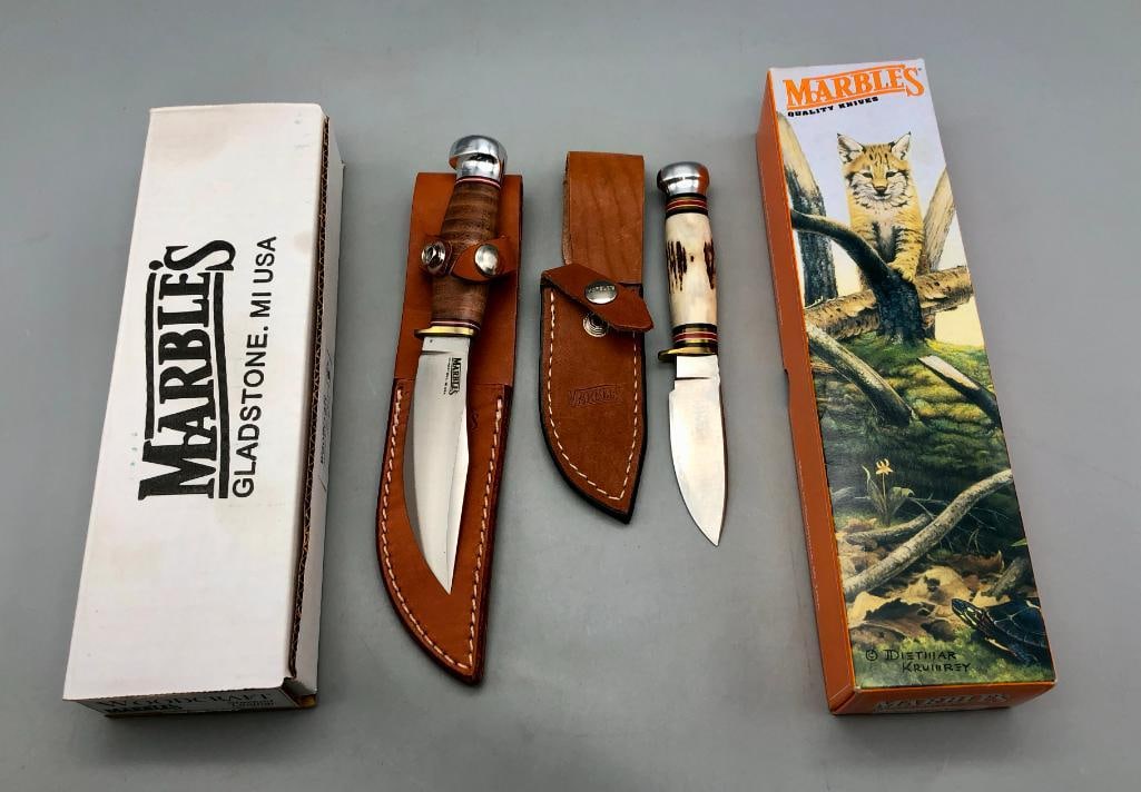 Two Marbles Knives Like New With Boxes: Offered here for your consideration are two marbles knives like new with boxes. These are fixed blade commemorative knives and each come in their original box and with a sheath. The first knife has a