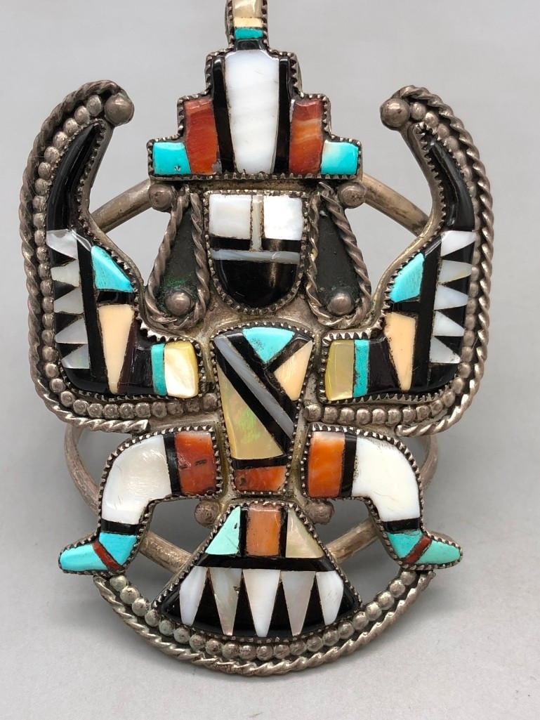 Vintage Knifewing Inlay Bracelet: Available here is a vintage knifewing inlay bracelet. This incredible piece features turquoise, coral, onyx, and mother of pearl inlay set in an impressive knifewing design. Silverwork of twisted wire