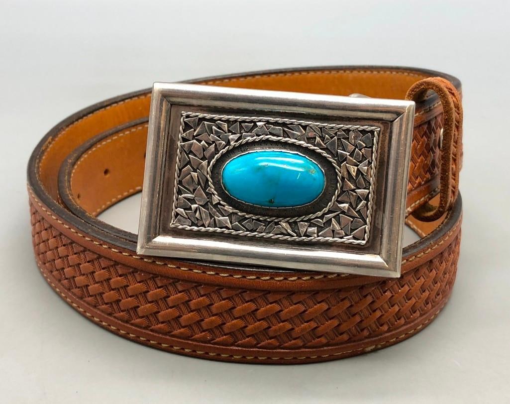 Turquoise and Sterling Silver Belt Buckle with Nice Leather Belt: Presented here is a turquoise and sterling silver belt buckle with a nice leather belt. This belt buckle features a gorgeous turquoise cabochon as a centerpiece. The setting is accented with unique st