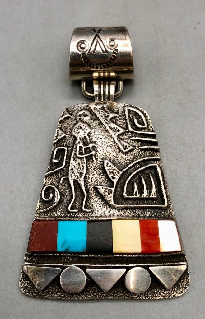 Great Tufa Cast Inlay Pendant By Harold Lovato: Offered here is a great Tufa Cast inlay pendant by Harold Lovato. This piece features a neat tufa cast setting with a mosaic inlay created with turquoise, onyx, coral, mother of pearl, and other stone