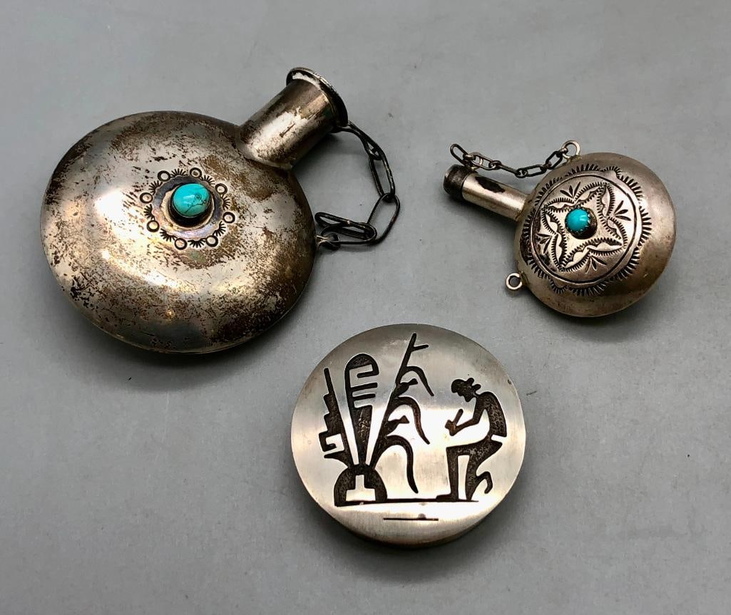 Two Sterling Silver Canteens And One Pill Box: Offered here for your consideration are two sterling silver canteens and one pill box. The canteens are of similar designs featuring one central turquoise cabochon on each side of the piece, each rest