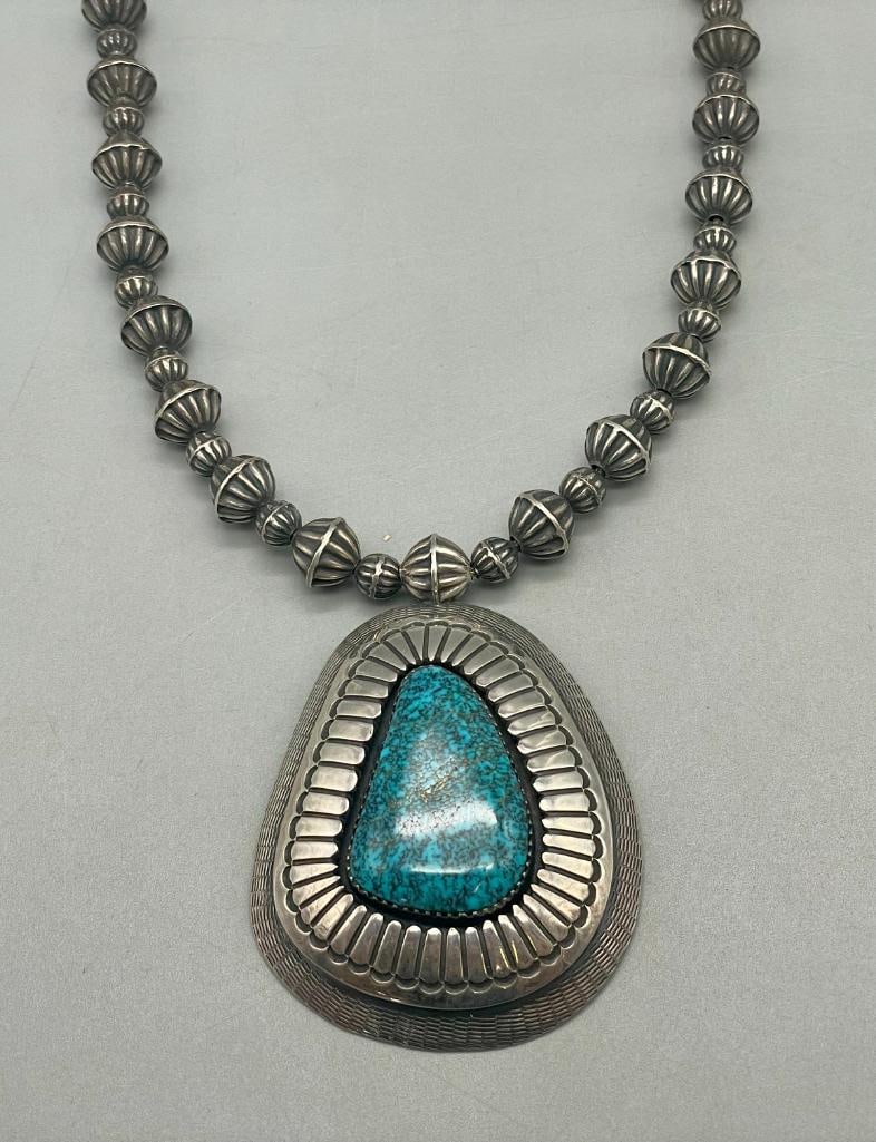 High Grade Turquoise And Sterling Silver Necklace By Bessie And Lee Yazzie: Offered here for your consideration is a high grade turquoise and sterling silver necklace by Bessie And Lee Yazzie. This necklace features one beautiful turquoise cabochon, that looks to be Lone