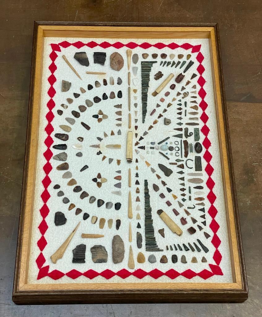 Large Framed Artifact Display: Presented here for your bidding pleasure is a large framed artifact display. This attractive display includes hand shaped artifacts crafted from bone, stone, metal and clay. There are finely worked ar