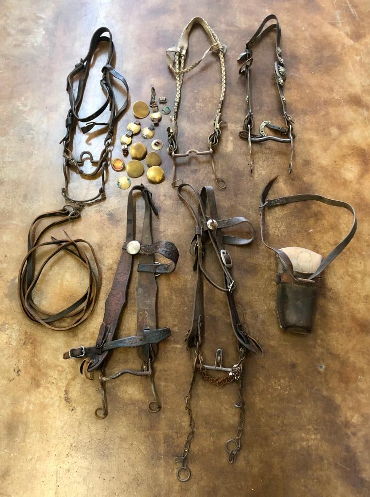 A Miscellaneous Group Including Old Bridles, Rosettes And Stirrup: Offered here for your consideration is a miscellaneous group, including old bridles, rosettes and stirrup. This group consists of older, interesting items of tack. They would fit well into your collec