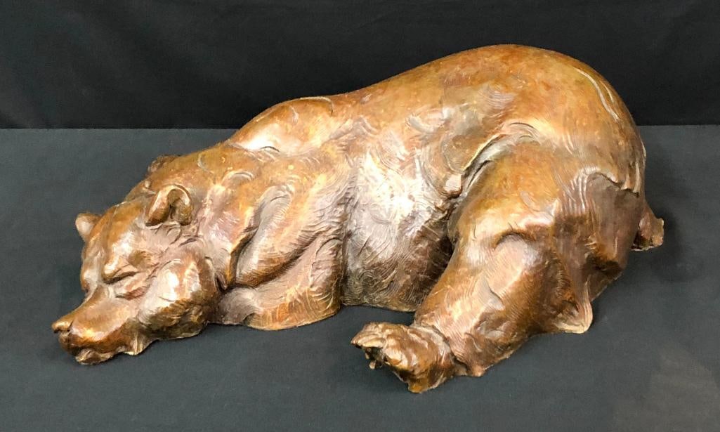Indigo's Dream A Bronze By Don Ostermiller: Presented here is Indigo's Dream, a bronze by Don Ostermiller. This engaging sculpture of a slumbering bear is numbered 11 of 20. This bear, eyes closed in dream filled slumber, is a detailed rend