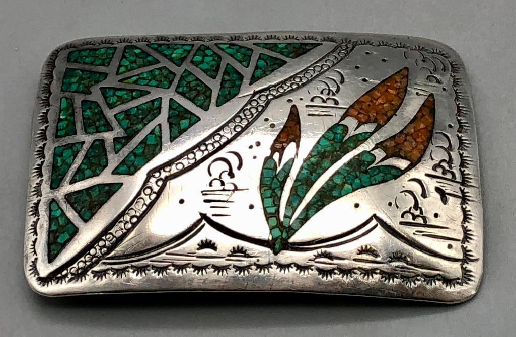 Vintage Chip Inlay Belt Buckle By Tommy Singer: Presented here for your bidding pleasure is a vintage chip inlay belt buckle by Tommy Singer. This sterling silver buckle has an eye-catching chip inlay design with multiple settings of coral and turq