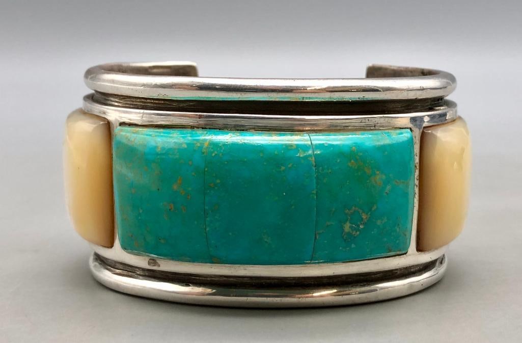 Mother Of Pearl And Turquoise Inlay Bracelet: For your bidding enjoyment we present a mother of pearl and turquoise inlay bracelet. This eye-catching bracelet is highlighted with a nice inlay of turquoise and mother of pearl. The turquoise inlay 
