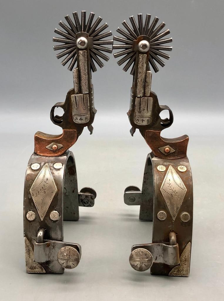 Pair Of Pistol Themed Spurs By Tim Hunter: Offered here for your consideration is a pair of pistol themed spurs by Tim Hunter. These double mounted spurs have a silver plate on the outer side of each heel band and are mounted with a silver he