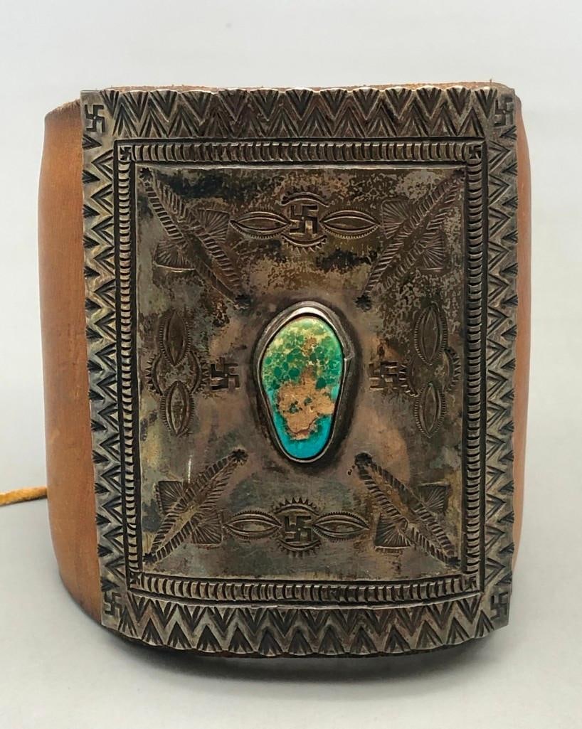 Older Turquoise And Sterling Silver Ketoh With Many Symbols: Available here for your consideration is an older turquoise and sterling silver ketoh with many symbols. This nice ketoh has a central turquoise cabochon resting in a smooth silver bezel. The silver p