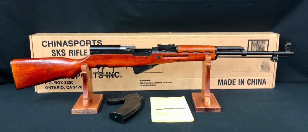 Norinco SKS Rifle.: For your bidding pleasure is a Norinco SKS semi-automatic rifle chambered in 7.62x39. It is in as new in the box and includes the instruction manual and a 30 round magazine as well as the five round m