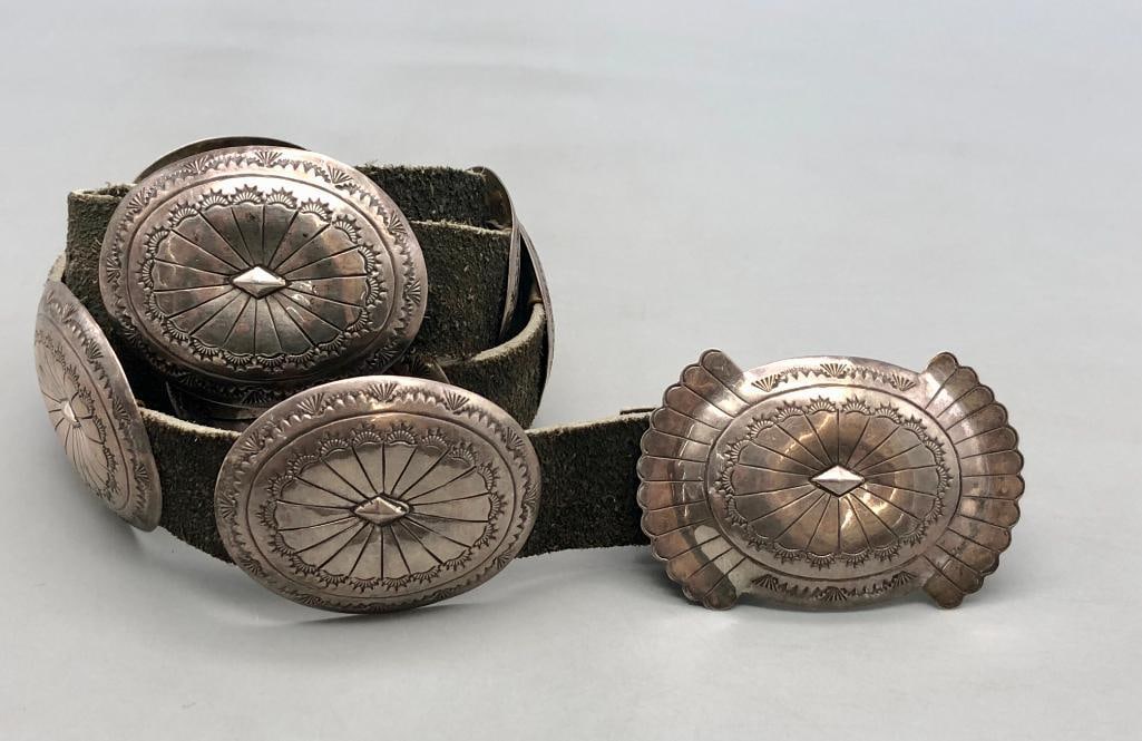 Vintage Sterling Silver Stamped Concho Belt: Offered here for your consideration is a vintage sterling silver stamped concho belt. The belt has nine oval conchos and one rectangular buckle, each with hand stamped designs and a repousse diamond s