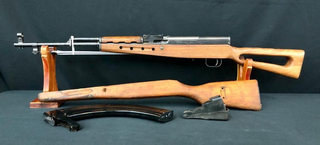 SKS Semi-automatic Rifle: Offered here is an SKS semi-automatic rifle complete with the expected hardware, plus an original bayonet and a banana magazine that appears to hold 40 rounds. A second stock that you may finish to yo