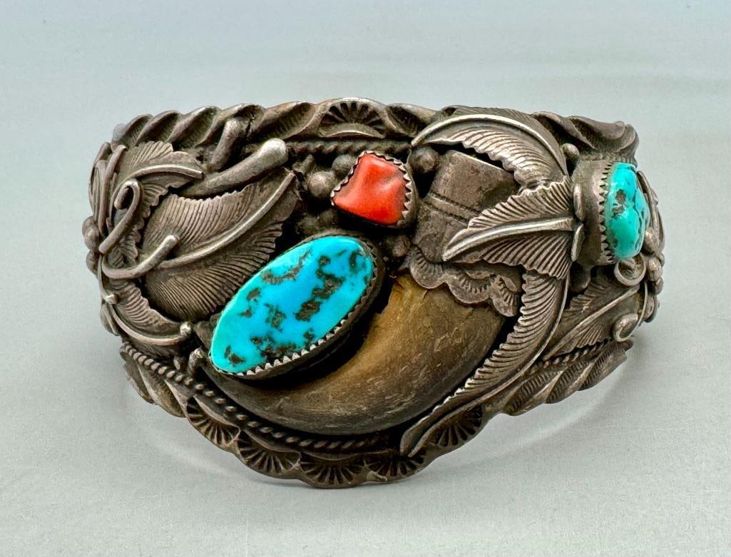 Vintage Turquoise, Coral And Claw Bracelet By Lester Craig: For your bidding enjoyment we present a vintage turquoise, coral and claw bracelet by Lester Craig. This bracelet features two turquoise and one coral nugget style cabochons resting in handmade sawtoo