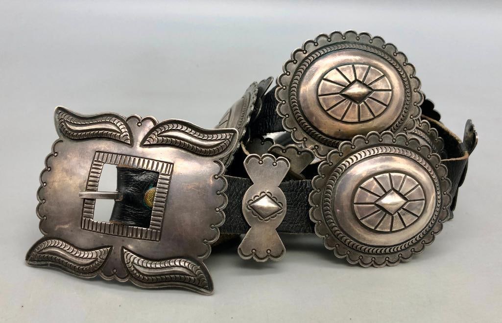 Circa 1930s to 1940s Era Sterling Silver Concho Belt: Offered here for your consideration is a circa 1930s to 1940s era sterling silver concho belt. The belt has seven oval conchos and eight butterfly conchos each with lovely hand stamped designs, repous