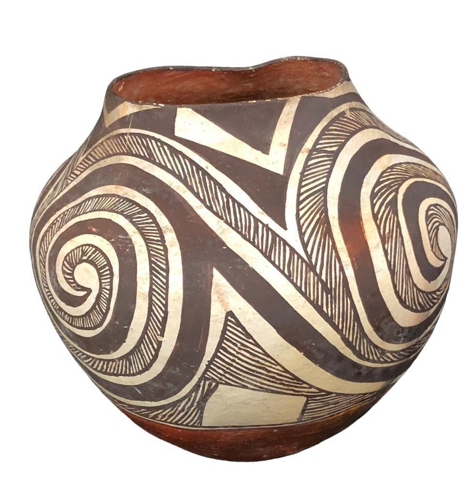Early 1900s Acoma Pottery Jar: Available here for your consideration is a lavishly decorated Acoma pottery jar from the early part of the 1900s. Traditional Acoma pottery is made from a slate-like clay sourced from the hills surrou