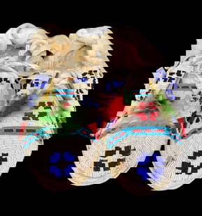 Circa 1960s To 1970s Beaded Moccasins: Offered here for your consideration is a pair of beaded moccasins from the 1960s to 1970s. These moccasins feature beautiful fine beadwork. Decorated against a base of white beads running from heel