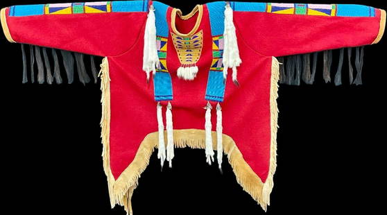 Retro Style Beaded and Ermine War Shirt: Offered here for your consideration is a retro style beaded and ermine war shirt. Constructed on a soft red felt body with slits down each side, the shirt's cuffs and hems are finished in