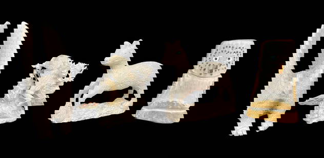 Group Of Four Carved Antler Fetishes: Four interesting fetishes all carved from antler are offered here for your buying pleasure. The moose descending a rocky strewn slope is the work of well known Zuni fetish carver, Pernell Laate, and