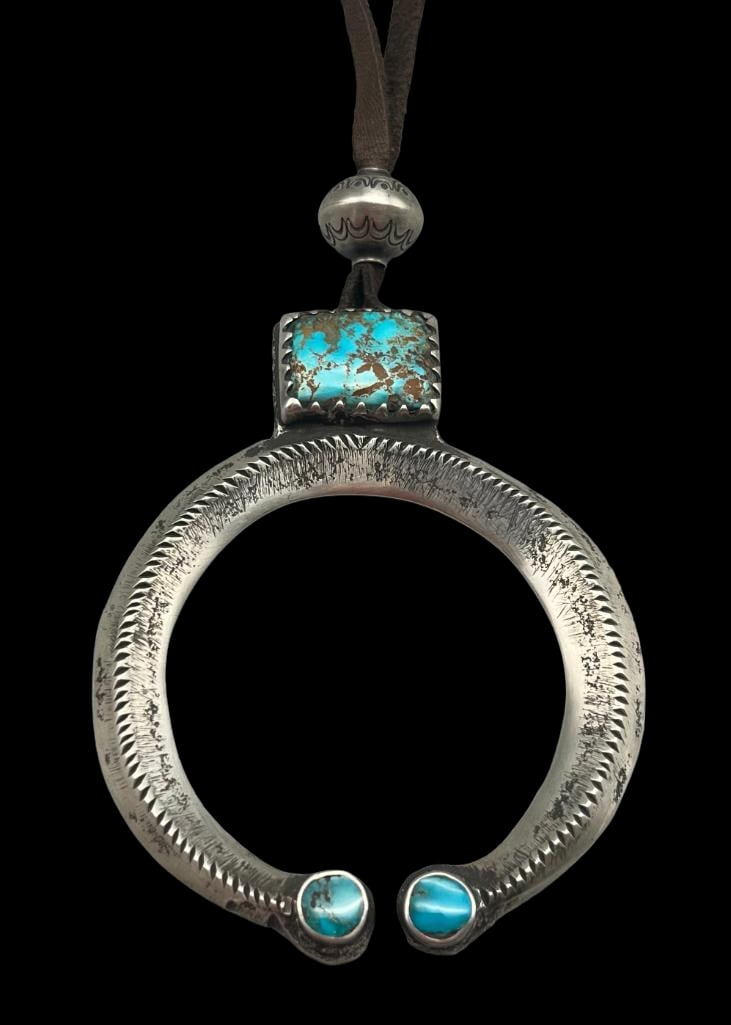 Handmade Ingot Silver And Turquoise Naja By Bubba Shackelford: Offered here is a handmade ingot silver and turquoise naja by Bubba Shackelford. This handmade ingot naja features a rectangular shaped blue Royston turquoise cabochon resting in a large sawtooth silv