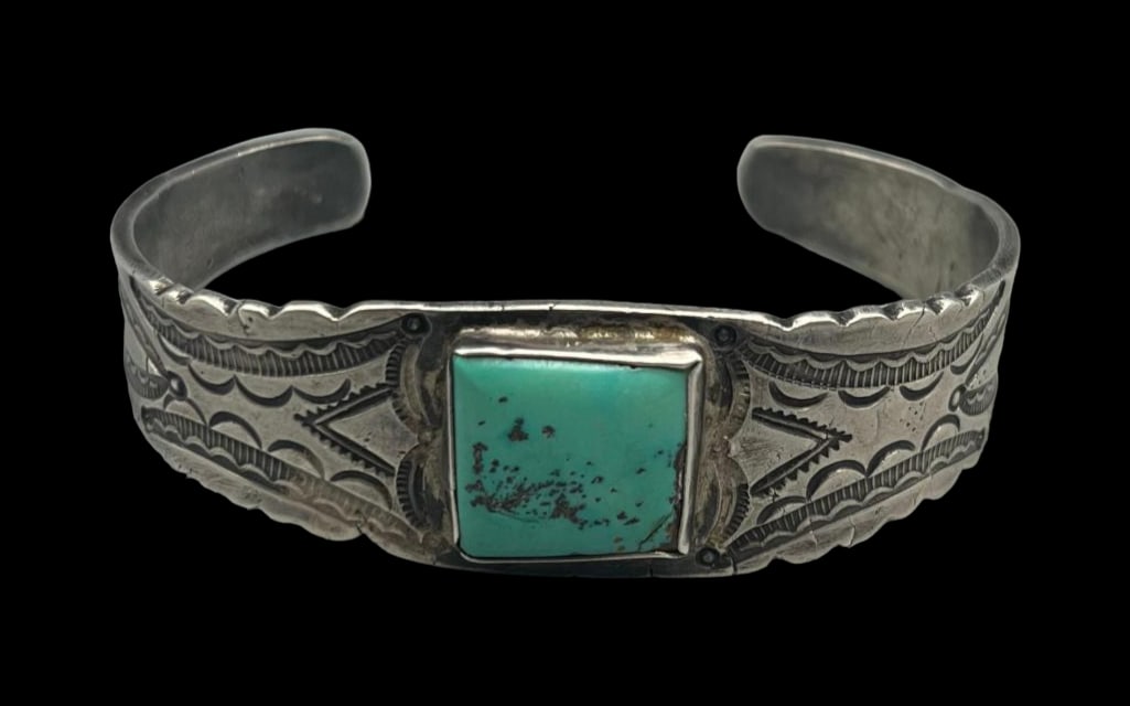 Vintage Ingot Silver And Turquoise Bracelet: For your bidding enjoyment we present a vintage ingot silver and turquoise bracelet. This bracelet showcases a square shaped turquoise cabochon resting in a smooth silver bezel, and elegantly displaye