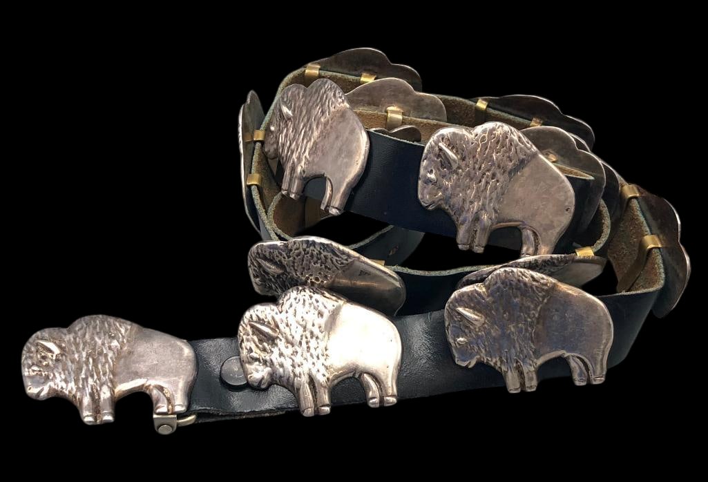 Hefty Buffalo Themed Concho Belt: Offered here for your consideration is a hefty buffalo themed concho belt. The belt has fourteen conchos and one buckle. The conchos and buckle are matching buffalo designs with heavily textured detai