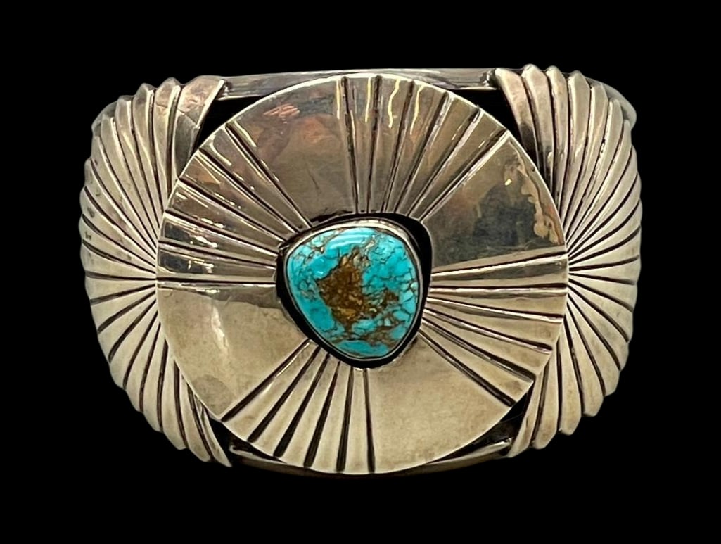 New Old Stock Turquoise Bracelet By Notah Johnson: For your bidding enjoyment we present a new old stock turquoise bracelet by Notah Johnson. This gorgeous bracelet is highlighted with a central turquoise cabochon displayed in a smooth silver bezel. T